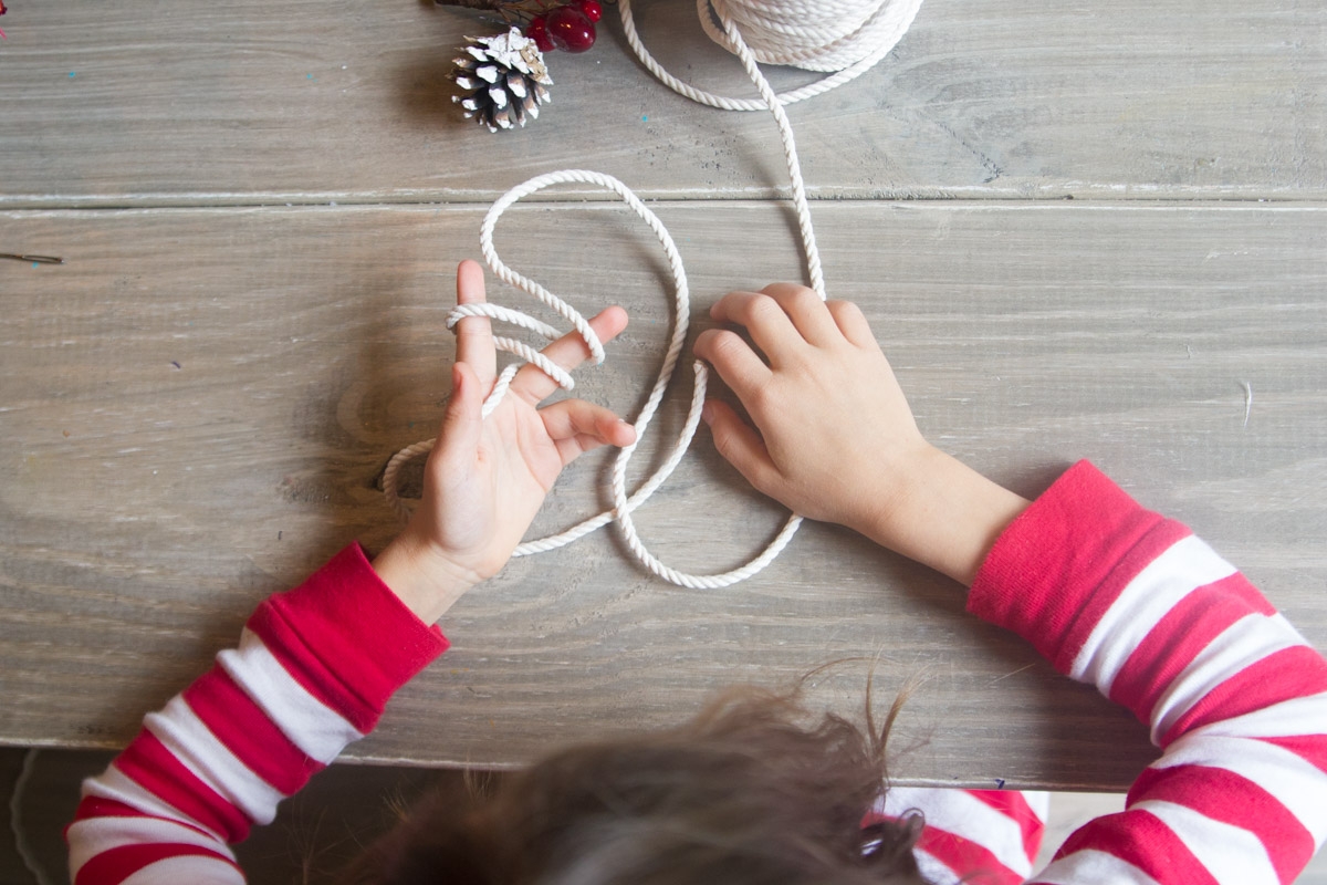 Easy finger-knitted wreath ornament, perfect craft for kids! | www.PracticallyHIppie.com