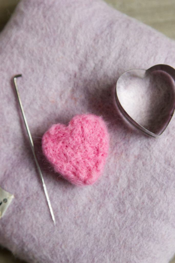 Needle felted hearts with cookie cutters with an instructional story