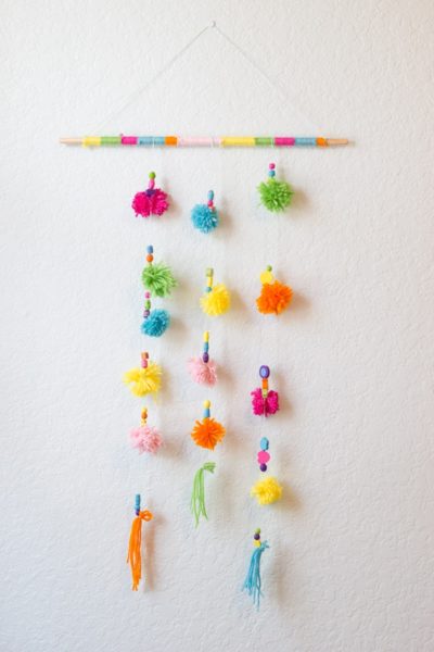 Easy yarn pom pom wall hanging, simple DIY project to add fun and whimsy to any room #DIYproject #handcraft #kidscrafts